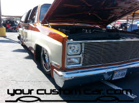two tone suburban, on air bags, friends in low places, car show