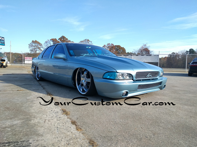 The Front of our 1996 Custom Impala SS features a custom front bumper cover...