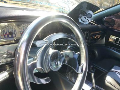 The interior features an array of polished billet aluminum items, suede and leather seat upholstery and fully smoothed and fiberglassed (except for the carpet! LOL) interior.